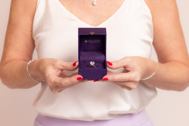 Yelton Fine Jewelers engagement ring presented in a signature purple Yelton ring box